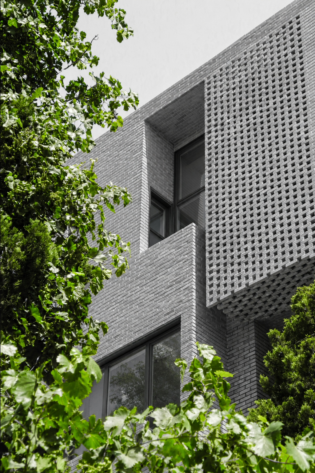 Calm City architecture project with textured facade and greenery